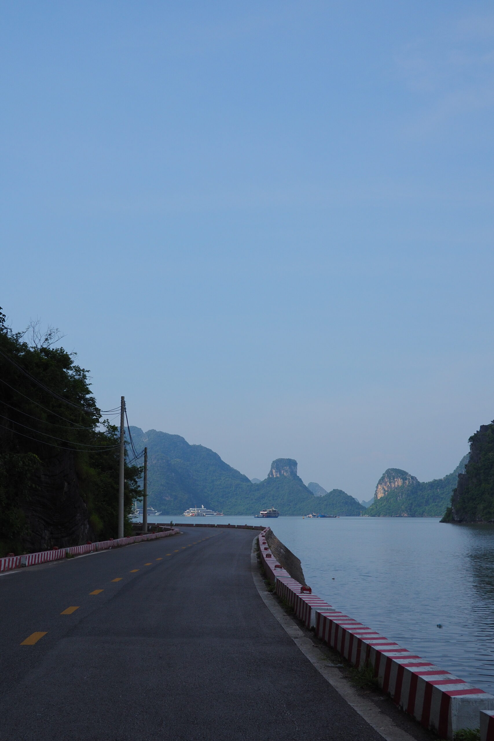 Quiet coastal road curving beside the bay